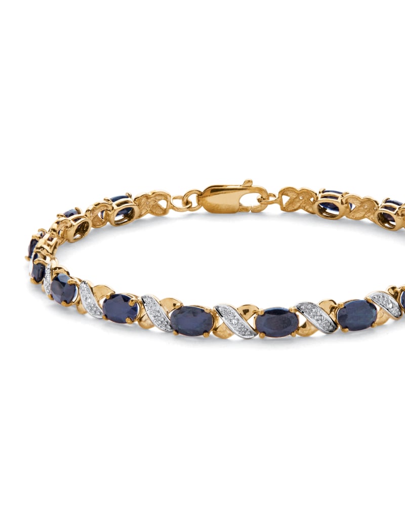Front of a size 7.5 in 8.44 TCW Genuine Blue Sapphire 10k Yellow Gold "X & O" Tennis Bracelet 7 1/2" in Blue by PalmBeach Jewelry. | dia_product_style_image_id:286414